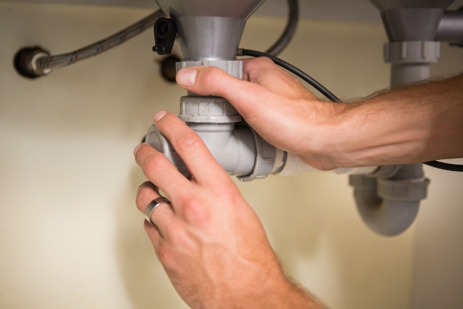 Specialist checking a pressure gauge during a leak detection survey