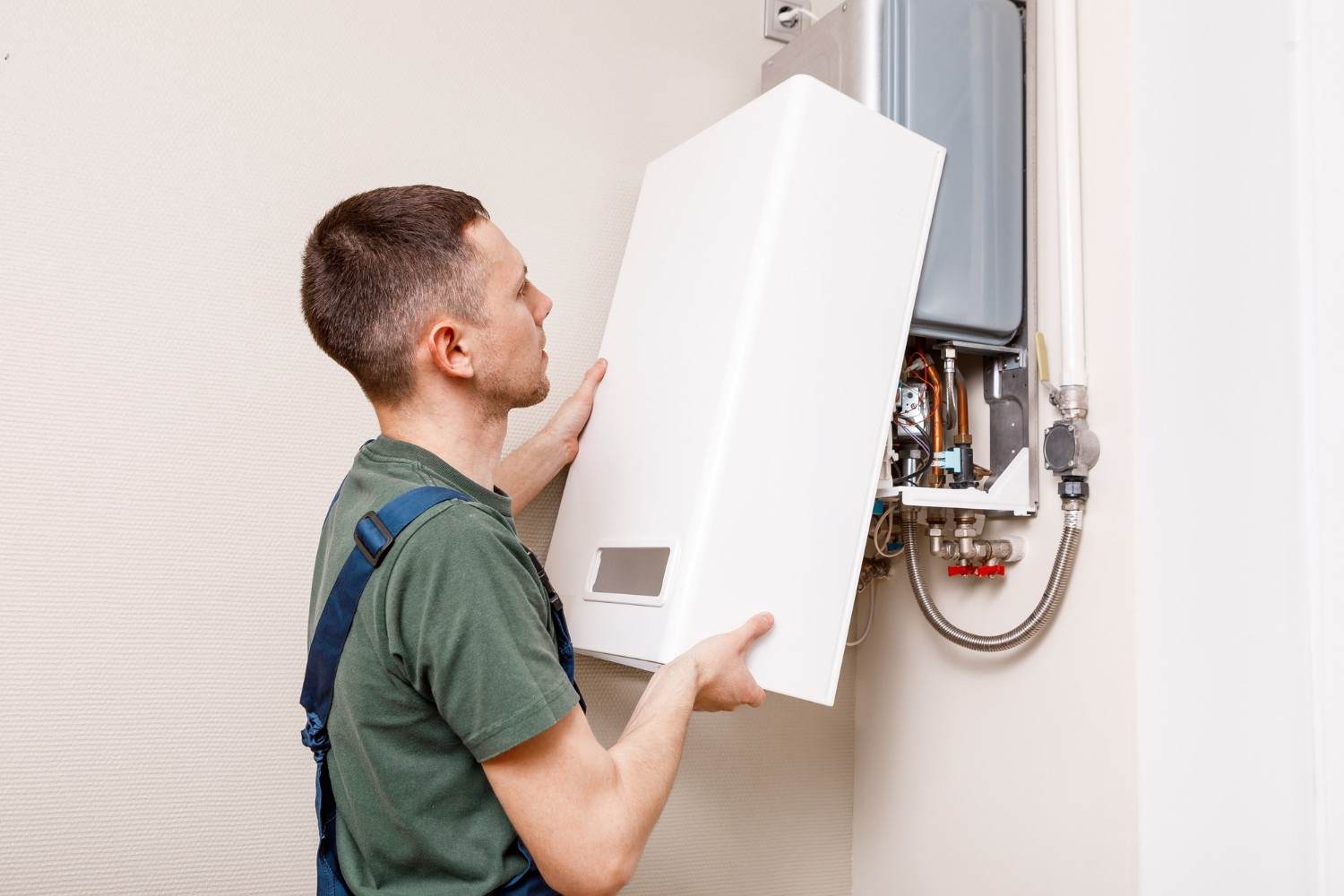 Engineer inspecting a boiler showing fault signs in Richmond