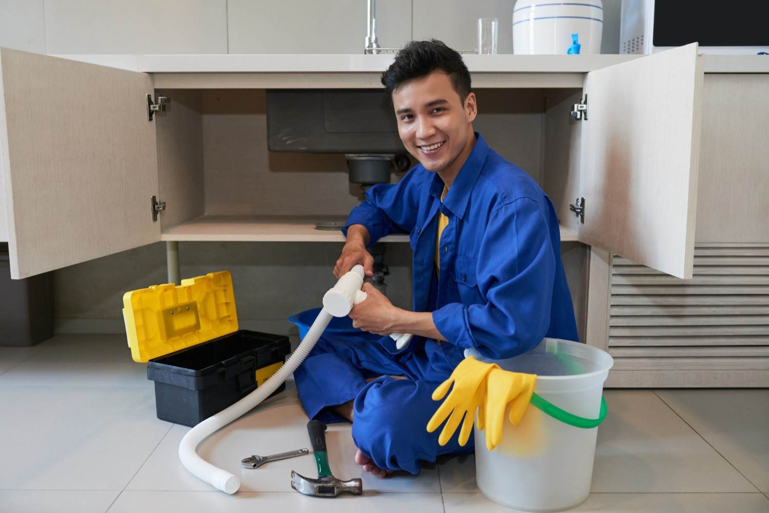 Plumber inspecting a plumbing system